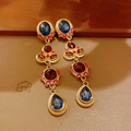 Macro detail of vintage gold earrings with blue and burgundy gems on brown leather - 41# Silver Pin Rhinestone Teardrop Stud Earrings
