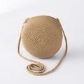 Detailed close-up of a round light brown straw woven shoulder bag with zipper for kids - Khaki Large Round Bag (15*7cm)