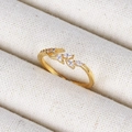 Macro detail of 18K gold leaf ring with marquise cut zircon stones on fabric - Leaf Shaped Zircon Gold Style (Style 18 Gold)