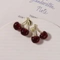 Detail of red glitter resin cherry charms with golden metal leaves on a white plate - Gold Stem Glitter Red / 1 Piece