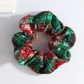 Detailed view of red and green plaid plush scrunchie with white snowflake patterns - Snowflake Red Green Wide Stripe