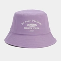 Close-up of purple canvas bucket hat featuring white embroidered artistic lettering detail - Light Purple
