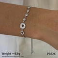 Silver sun and moon bracelet featuring zircon accents and a white shell charm piece - Round Silver