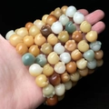 Handcrafted multi-loop bead bracelet with carved colorful bodhi root cat claw charms - Multicolor Cat Paw