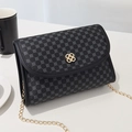 Modern women's crossbody bag with black clover print, gold metal lock, and chain strap - Black