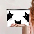 Détail de la pochette en toile blanche avec trois silhouettes de chats noirs et fermeture éclair - Style Silhouette de Chat Noir(jiayingpbb0404)