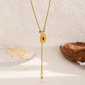 Close-up of golden sunflower shield necklace with red gemstone and snake chain detail - Rectangle Shield Style (A-408)