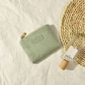 Minimalist light green faux leather coin purse with MO MO DOG logo and gold zipper - Green