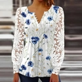 Detail of white V-neck blouse featuring delicate lace sleeves and blue floral patterns - S / Tops / Blue Flower