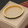 Bracciale vintage in acciaio dorato con motivi occhio blu su un portagioie beige - Motivo Occhio Nero (4#)
