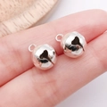 Pair of polished silver metal bell charms with heart cut-out detail for DIY jewelry - 10mm / Bright Silver