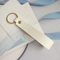 Minimalist cream white leather keychain with lychee texture and golden metal ring - White