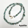 Macro detail of natural apatite stone chips necklace with gold-plated lobster clasp - Apatite
