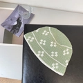 Dettaglio della trama intrecciata a mano del cappello alla pescatora verde chiaro e bianco - Verde Erba