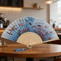 Classic blue folding fan with plum blossom ink painting and a delicate blue tassel - Style 49 (New Style)