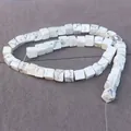 Macro shot of square white turquoise beads with natural marble texture for DIY jewelry - Howlite
