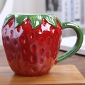 Vibrant strawberry shaped ceramic mug with realistic seeds and green leaf handle decor - Strawberry Shape / Red