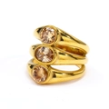 Detailed macro of gold-plated triple-layer ring with champagne oval and round zircons - Gold Champagne Stone