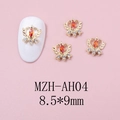 Macro detail of winged crown heart nail charm with red zircon and rhinestones - Gold Base Red Zircon Style (AH04)