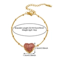 Macro view of 18k gold heart bracelet with pink stones and 23cm length measurements - Gold Pink Zirconia