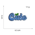 Detail of blue 'Cute' embroidered patch with green seedling and heat adhesive backing - Cute Text