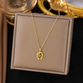 Elegant gold titanium necklace with oval black stone pendant on vintage display box - Black Mirror Oval (H91)