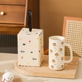 Beige puppy ceramic mug with matching gift box and black ribbon handle on wooden tray - Scarf Dachshund