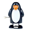 Wind-up penguin toy with white winding key on a clean white background studio shot - Wind-up Walking Thin Penguin