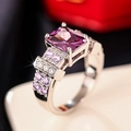Macro view of a square purple gemstone ring with pink and white pavé setting - US 6 / Purple