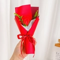 Detail of hand holding a single red soap rose bouquet with Happy Everyday ribbon decoration - Red