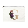 Canvas makeup bag with gold letter G and purple floral print on white background - Letter G