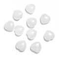 Flat lay of white heart-shaped crystals made of polished natural opal gemstones - White Crystal