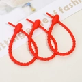 Three red silicone cable ties for cable management and DIY accessory organizers - Red