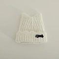 Close-up of the soft cream knit fabric and detailed black cat embroidery on the winter hat - 3-10 Years / White Cat