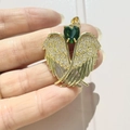 Detail of gold angel wing pendant with green heart stone and zircon micro-pave - Gold-Green