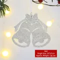 Silver glitter Christmas bell ornament with white bow hanging on a warm festive tree - Silver White Glitter Bell-A