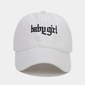 Close-up of black gothic Babygirl embroidery on a white cotton baseball cap detail - White