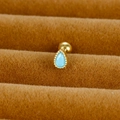 Macro shot of turquoise teardrop stone stud earring with gold bead edging detail - Teardrop / Gold / Sky Blue