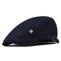 Detail of navy cotton flat cap with silver bird emblem and adjustable metal buckle strap - Adjustable / Navy Blue