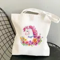 Dettaglio della borsa tote in tela bianca con vivace illustrazione di unicorno e fiori - Unicorno Floreale (B902-4)