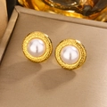 Macro shot of French vintage pearl stud earrings with textured gold metal frame - Gold White Pearl (E-364)