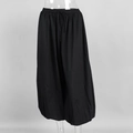 Detail of adjustable drawstring waistband on black cotton loose fit lantern pants - S / Black