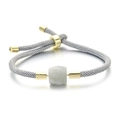 Bracelet ajustable en cordon tressé avec perle de pierre naturelle et détails dorés - Aigue-marine / Corde Grise