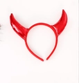 Close-up of shiny red devil horn headband for Halloween with metallic glitter texture - Red Glossy Horn Headband