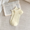 Breathable cream yellow ribbed cotton ankle socks with rolled edge on a book background - One Size / Light Yellow