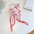 Detailed macro view of floral twilly silk scarf with red roses and elegant satin texture - Red Rose Floral
