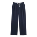 Detalle de los pantalones anchos azul marino con cordón blanco y cintura elástica - XS / Azul