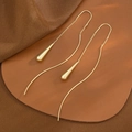 Long golden tassel drop earrings with teardrop pendants on elegant leather backdrop - Light KC Gold Water Drop Ear Line (K-1567)