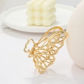 Elegante pinza per capelli a farfalla in metallo dorato con delicata trama ad ali forate - Stile Farfalla Traforata