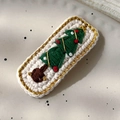 Close-up of a white crocheted hair clip featuring a green Christmas tree embroidery - 26228H White Base Green Tree Embroidered BB Clip